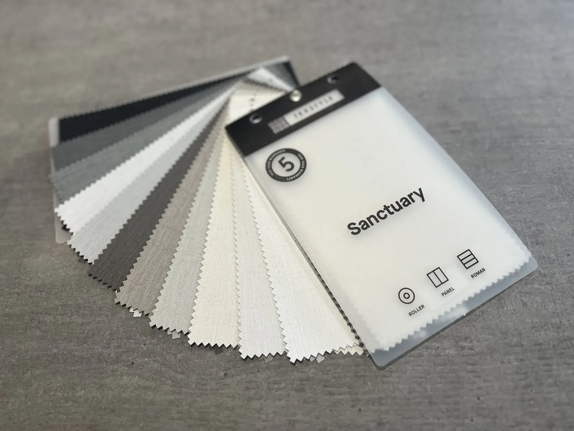 Sanctuary blockout fabric samples fanned out across a benchtop